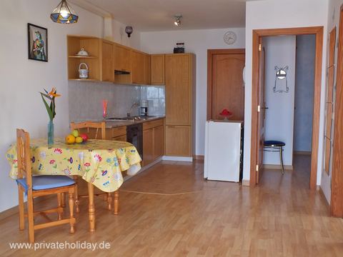 Kitchen area with dining table and wooden cabinets – El Sauzal, Tenerife