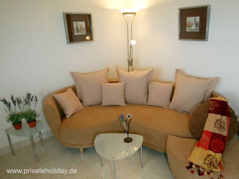 Living room with corner sofa and floor lamp – Chio, Tenerife
