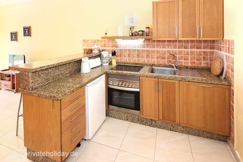Kitchen with granite countertop and wooden cabinets – Chio, Tenerife
