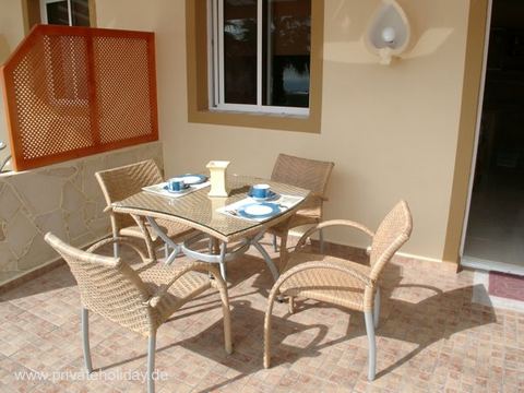 Covered terrace with dining table and wicker chairs – Chio, Tenerife