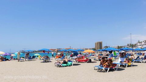 Sandy beach with sun loungers and umbrellas – Chayofa, Tenerife