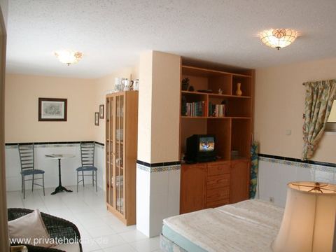 Living area with double bed and TV cabinet – Chayofa, Tenerife