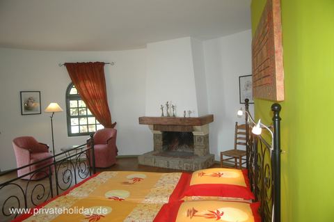 Living room with fireplace and armchairs – La Matanza, Tenerife