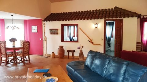 Living room with blue sofa and dining area – La Matanza, Tenerife