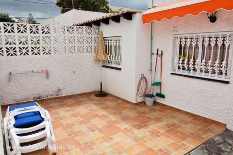 Tiled patio with awning and cleaning tools – Los Cristianos, Tenerife
