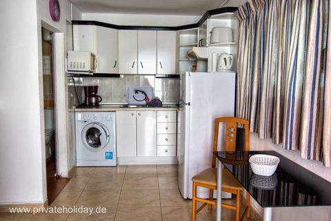 Kitchen area with dining table and curtain – Los Cristianos, Tenerife