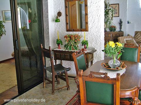 Dining area with wooden table and glass door – Poris de Abona, Tenerife
