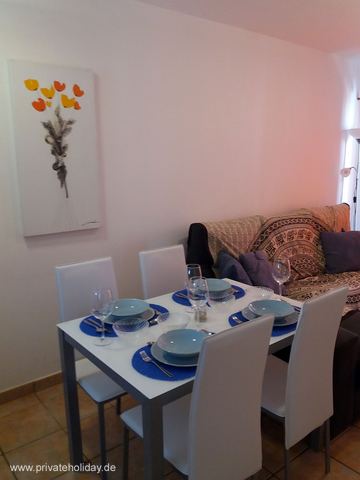 Dining area with set table and sofa – Costa Calma, Fuerteventura
