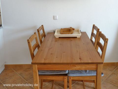 Dining area with wooden table and four chairs – Costa Calma, Fuerteventura