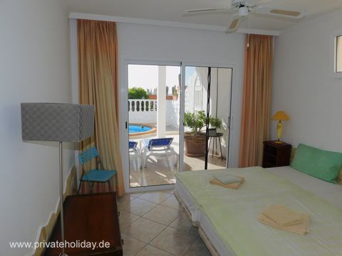 Bedroom with bed, wardrobe and patio access – Costa Calma, Fuerteventura