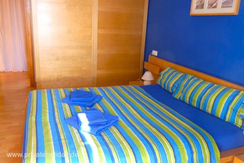 Bedroom with double bed and colorful bedding – Costa Calma, Fuerteventura