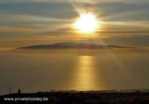 Puesta de sol sobre el mar y una isla – Guía de Isora, Tenerife
