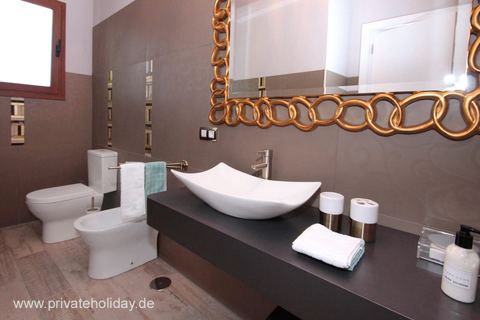 Modern bathroom with oval sink and mirror – Guía de Isora, Tenerife
