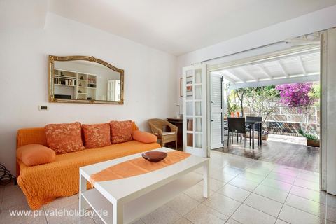 Living room with open terrace and orange sofa – Chayofa, Tenerife