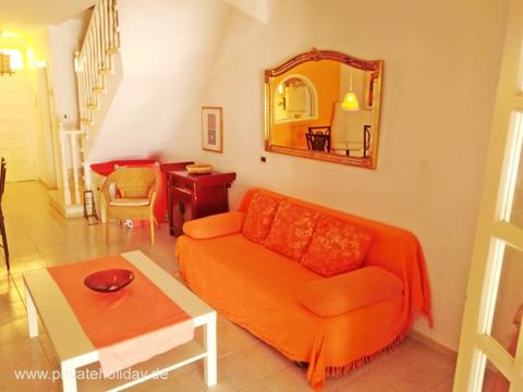 Living room with orange sofa and staircase – Chayofa, Tenerife