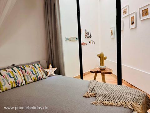 Bedroom with double bed and armchair – Costa Calma, Fuerteventura