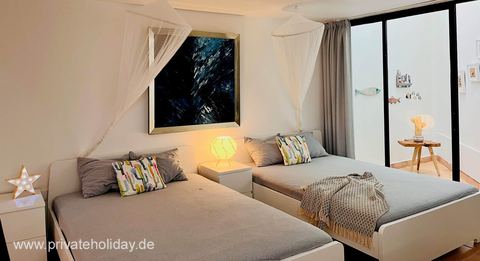 Bedroom with two beds and patio door – Costa Calma, Fuerteventura