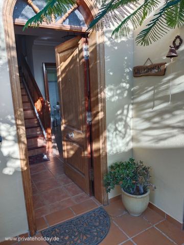 Entrance area with open wooden door and stairs – Candelaria, Tenerife