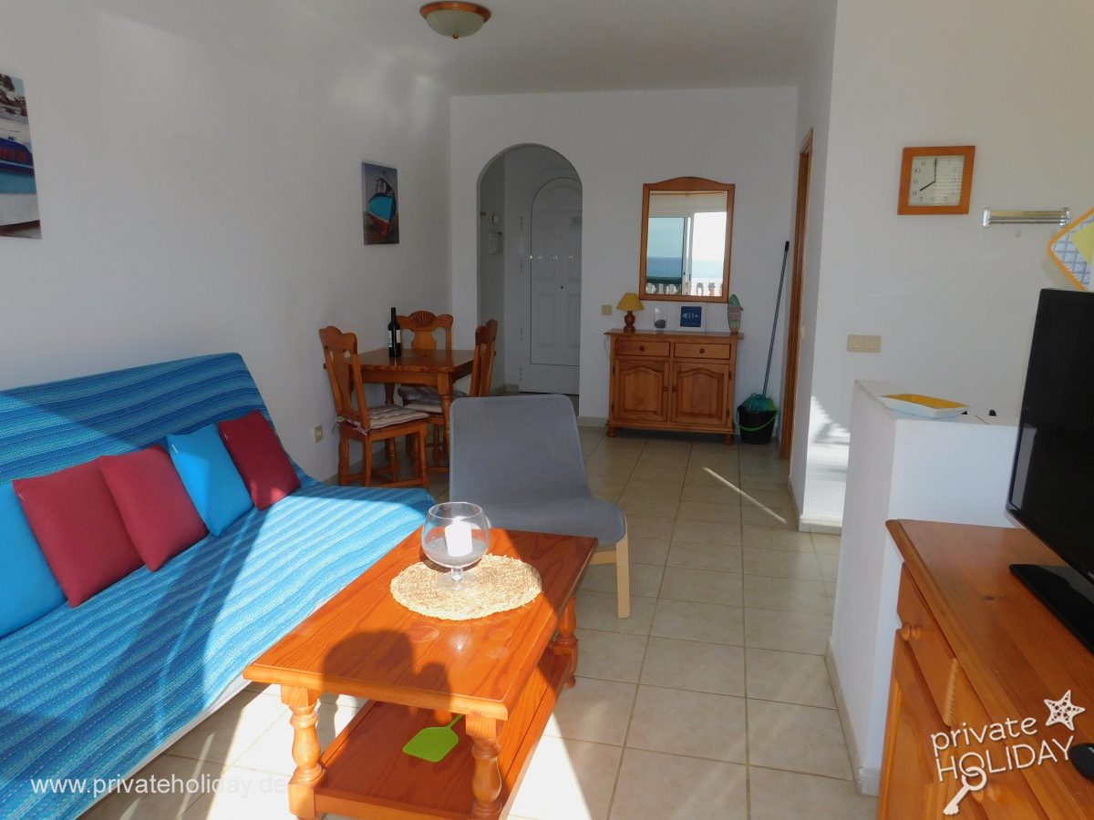 Zona giorno con divano, tavolo da pranzo e TV – Costa Calma, Fuerteventura