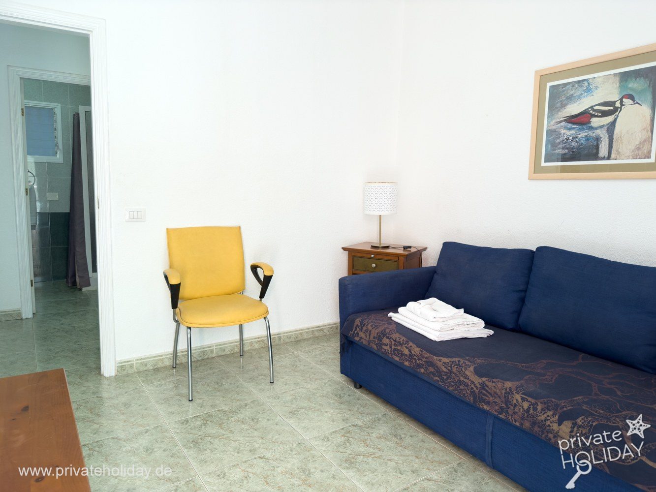 Living room with sofa and yellow chair – Los Cristianos, Tenerife