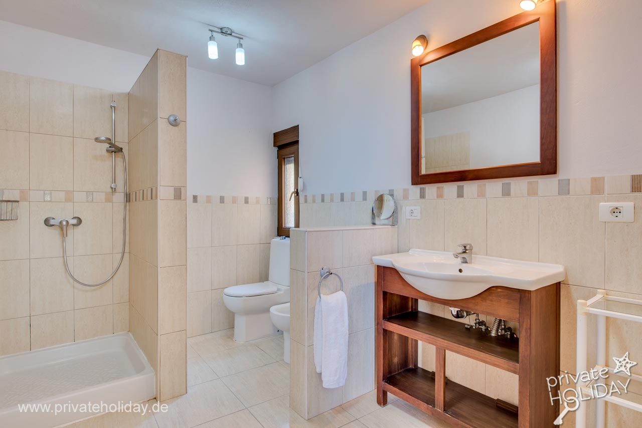 Bathroom with shower, tub and wooden vanity – Guía de Isora, Tenerife