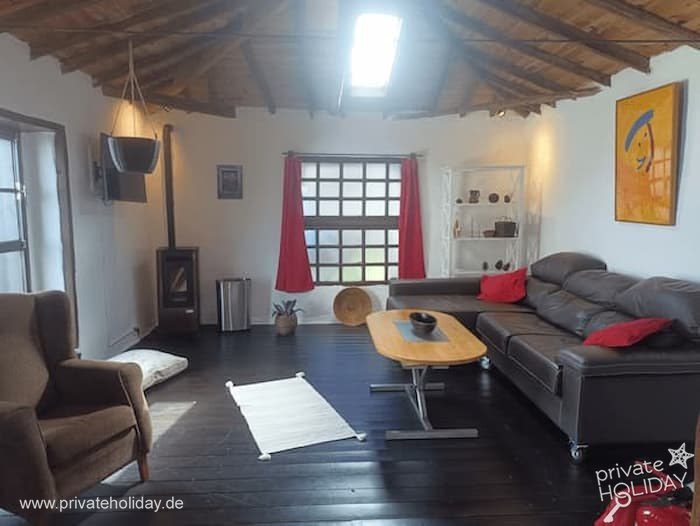Living room with sofa, fireplace and wooden table – Icod de los Vinos, Tenerife